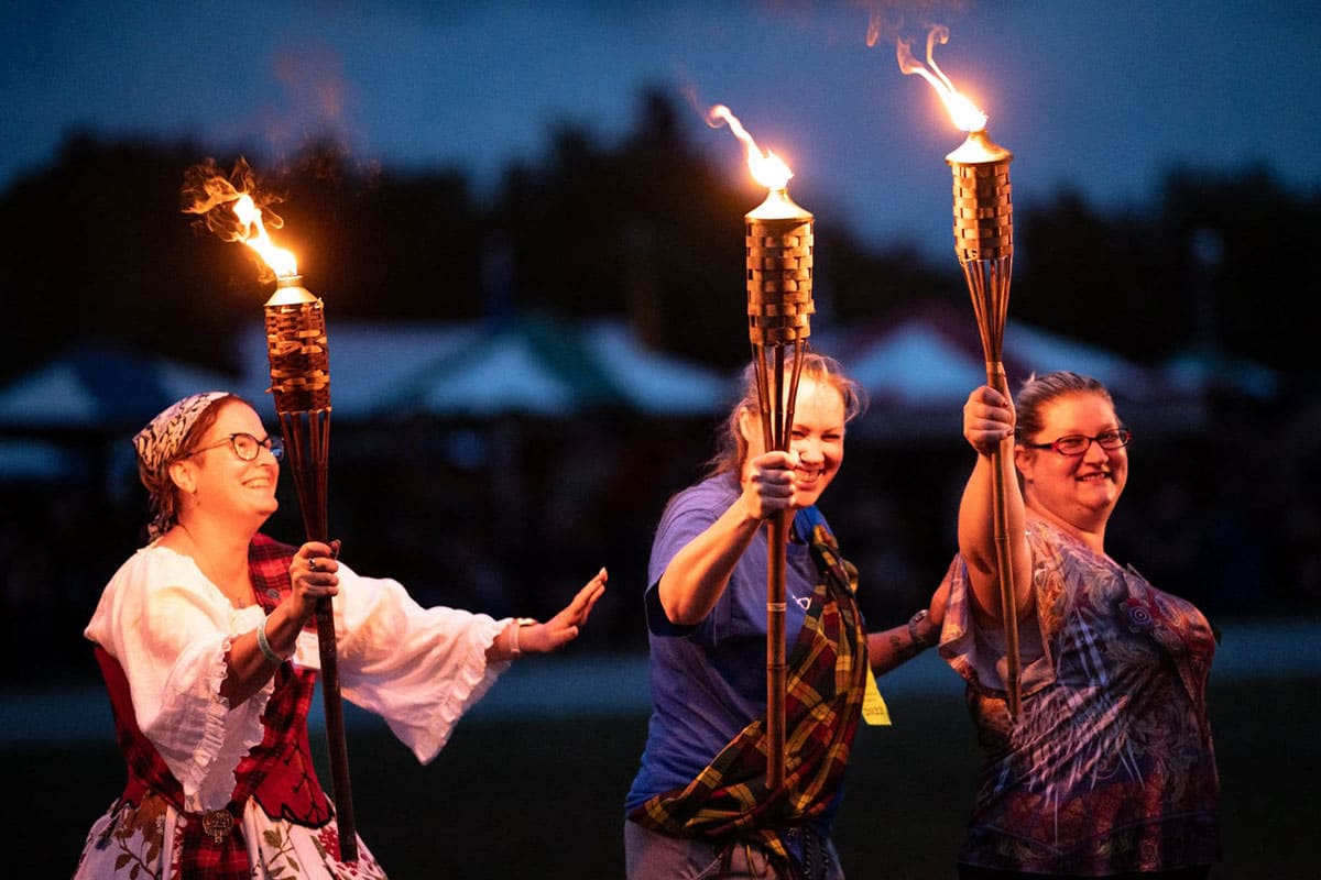 People Holding Torches